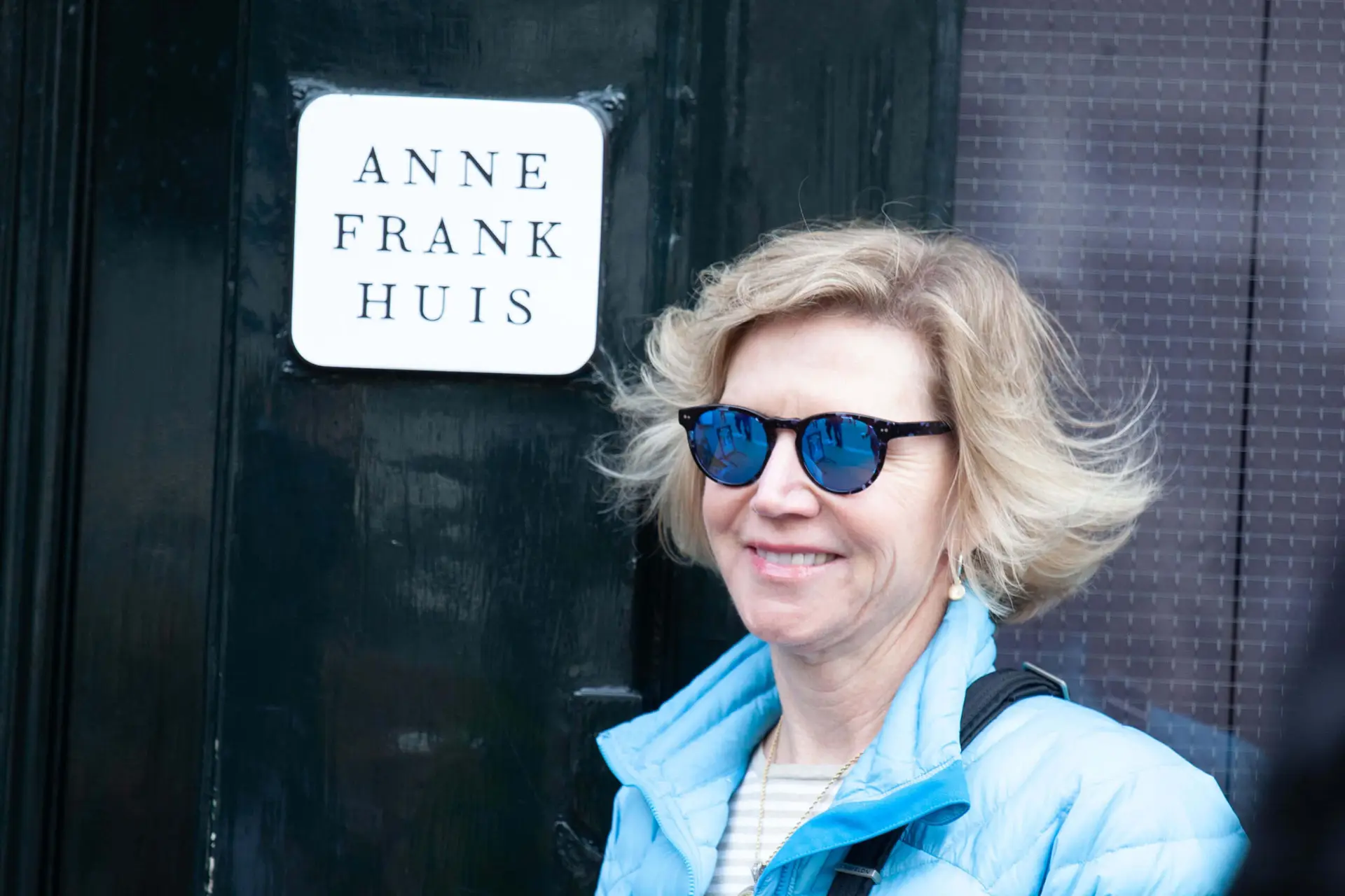 woman outside anne frank